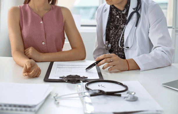 Clinician reviewing paperwork with a patient